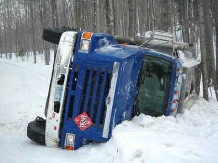 Fuel truck rolls over on snowy roads